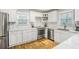 Updated kitchen featuring white cabinets, stainless steel appliances, and marble countertops at 133 Cross Gate Dr, Marietta, GA 30068