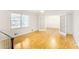 Upstairs living area with hardwood floors and natural light flowing through the double french doors at 133 Cross Gate Dr, Marietta, GA 30068