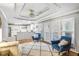 Cozy living room featuring fireplace, hardwood floors, tray ceiling, and abundant natural light at 133 Cross Gate Dr, Marietta, GA 30068