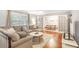 Bright living room featuring hardwood floors, a sectional sofa, and French doors to dining room at 133 Cross Gate Dr, Marietta, GA 30068
