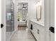 Bright bathroom with glass enclosed shower and double vanity, connecting to a bedroom at 228 Idylwilde Way, Canton, GA 30115