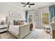 Comfortable bedroom with plush bedding, natural light, and views of trees at 228 Idylwilde Way, Canton, GA 30115