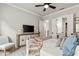 Bedroom featuring a television, a built-in dresser, and an attached bathroom at 228 Idylwilde Way, Canton, GA 30115