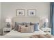 Bedroom features a comfy bed with plush pillows, side tables, and stylish decor at 228 Idylwilde Way, Canton, GA 30115
