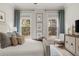 Serene bedroom with comfortable bedding, natural light, and stylish furniture at 228 Idylwilde Way, Canton, GA 30115
