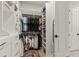 Walk in closet with ample storage and organized hanging spaces at 228 Idylwilde Way, Canton, GA 30115