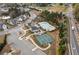 Aerial view of community with garden, pool, clubhouse, and tennis courts, surrounded by single Gathering homes at 228 Idylwilde Way, Canton, GA 30115