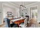 Dining room with rustic table, modern lighting, and sophisticated wall decor at 228 Idylwilde Way, Canton, GA 30115