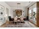 Formal dining room with natural light, stylish decor, and elegant chandelier at 228 Idylwilde Way, Canton, GA 30115