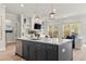 Bright and airy kitchen featuring an island with seating and stainless steel appliances at 228 Idylwilde Way, Canton, GA 30115