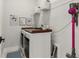 Functional laundry room with washer, dryer, shelving, and modern decor at 228 Idylwilde Way, Canton, GA 30115
