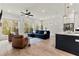 Bright living room with hardwood floors, shiplap walls, and view to back yard at 228 Idylwilde Way, Canton, GA 30115