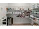 Spacious walk-in pantry with ample shelving for organized storage and a beverage fridge at 228 Idylwilde Way, Canton, GA 30115