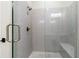 Contemporary bathroom shower with tiled walls, glass door, and rainfall shower head at 228 Idylwilde Way, Canton, GA 30115