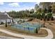 Several people are playing on the blue and green tennis courts in this active community at 228 Idylwilde Way, Canton, GA 30115
