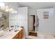 Bright bathroom with double vanity, large mirror, and bathtub at 4070 Amber Leaf Dr, Roswell, GA 30076