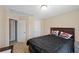 Clean bedroom with carpet flooring, double bed, and a view of the closet at 4070 Amber Leaf Dr, Roswell, GA 30076