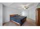 Bedroom featuring ceiling fan, carpet flooring, and plenty of natural light at 4070 Amber Leaf Dr, Roswell, GA 30076