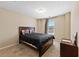 Cozy bedroom with carpet flooring, neutral color palette, and a comfortable double bed at 4070 Amber Leaf Dr, Roswell, GA 30076
