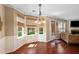 Cozy breakfast nook featuring hardwood floors, large windows with views, and seamlessly connects to the living area at 4070 Amber Leaf Dr, Roswell, GA 30076