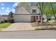 Charming two-story home with a two-car garage and well-maintained landscaping in a suburban neighborhood at 4070 Amber Leaf Dr, Roswell, GA 30076