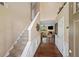 Inviting foyer featuring hardwood floors, staircase, and a glimpse into the cozy living room at 4070 Amber Leaf Dr, Roswell, GA 30076