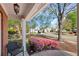 Inviting front porch with a view of a well-manicured lawn and a quiet, tree-lined street at 4070 Amber Leaf Dr, Roswell, GA 30076