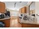 Well-maintained kitchen featuring granite countertops, stainless steel appliances, and wooden floors at 4070 Amber Leaf Dr, Roswell, GA 30076