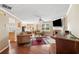 Spacious living room with hardwood floors, a fireplace, and plenty of natural light at 4070 Amber Leaf Dr, Roswell, GA 30076