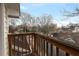 Balcony overlooking an established neighborhood with mature trees and unique rooflines at 873 Monroe Ne Cir, Atlanta, GA 30308