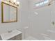 Modern bathroom with a stylish vanity, framed mirror, updated fixtures, and shower with a built in seat at 873 Monroe Ne Cir, Atlanta, GA 30308