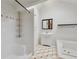 Bright bathroom with a shower, a soaking tub, vanity, and stylish tile flooring at 873 Monroe Ne Cir, Atlanta, GA 30308