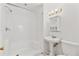 Bathroom featuring a stand up shower, pedestal sink, medicine cabinet and toilet at 873 Monroe Ne Cir, Atlanta, GA 30308