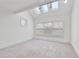Bright bedroom featuring multiple windows, neutral carpet and vaulted ceilings at 873 Monroe Ne Cir, Atlanta, GA 30308