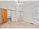 Bright bedroom with ample closet space, large windows, and neutral carpet flooring at 873 Monroe Ne Cir, Atlanta, GA 30308
