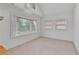 Light filled bedroom with bay windows providing plenty of natural light and a neutral color palette at 873 Monroe Ne Cir, Atlanta, GA 30308