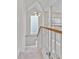 Bright hallway featuring white railings, and a large glass block window at 873 Monroe Ne Cir, Atlanta, GA 30308