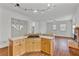 Open concept kitchen with bar seating, updated appliances, and a view of the living room with fireplace at 873 Monroe Ne Cir, Atlanta, GA 30308