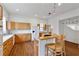 Charming kitchen with ample counter space, light wood cabinets, bar seating, and modern appliances at 873 Monroe Ne Cir, Atlanta, GA 30308