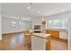 Kitchen, living room with fireplace, bar seating, modern appliances, and an open concept layout at 873 Monroe Ne Cir, Atlanta, GA 30308