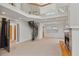 Open living room with high ceilings, fireplace, spiral staircase, and lots of natural light at 873 Monroe Ne Cir, Atlanta, GA 30308