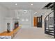 Bright living room with a fireplace, a spiral staircase, and two-story ceilings with many windows at 873 Monroe Ne Cir, Atlanta, GA 30308