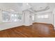 Bright living room with hardwood floors, high ceilings, a modern ceiling fan, and many windows at 873 Monroe Ne Cir, Atlanta, GA 30308