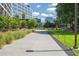 Scenic outdoor path surrounded by lush greenery, manicured lawns, and contemporary architecture in a vibrant community at 873 Monroe Ne Cir, Atlanta, GA 30308