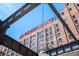 Close-up of the iconic Ponce City Market sign on a brick building, framed by an industrial steel structure at 873 Monroe Ne Cir, Atlanta, GA 30308