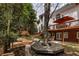 Backyard featuring a deck, patio, outdoor seating, a fire pit, and mature landscaping at 225 Cotton Field Ct, Alpharetta, GA 30022