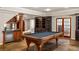 Recreational basement space with a pool table, wet bar, and custom wood finishes at 225 Cotton Field Ct, Alpharetta, GA 30022