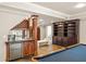 Basement features a mini bar, built-in shelving, pool table, and tile flooring at 225 Cotton Field Ct, Alpharetta, GA 30022