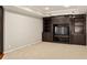 Finished basement featuring built-in shelving, recessed lighting, carpet and neutral colored walls at 225 Cotton Field Ct, Alpharetta, GA 30022