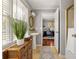 Charming bathroom featuring a pedestal sink, woven storage, and a view into the office at 225 Cotton Field Ct, Alpharetta, GA 30022